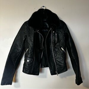 Black leather jacket with fur lined collar